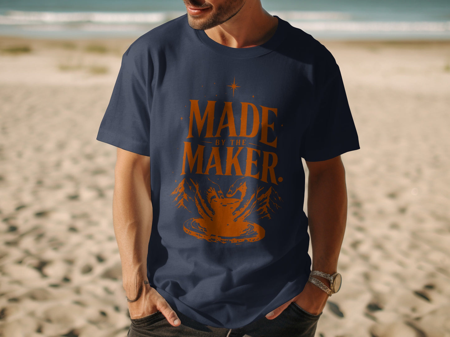 Navy t-shirt with orange "Made by the Maker" text and pottery graphic.
