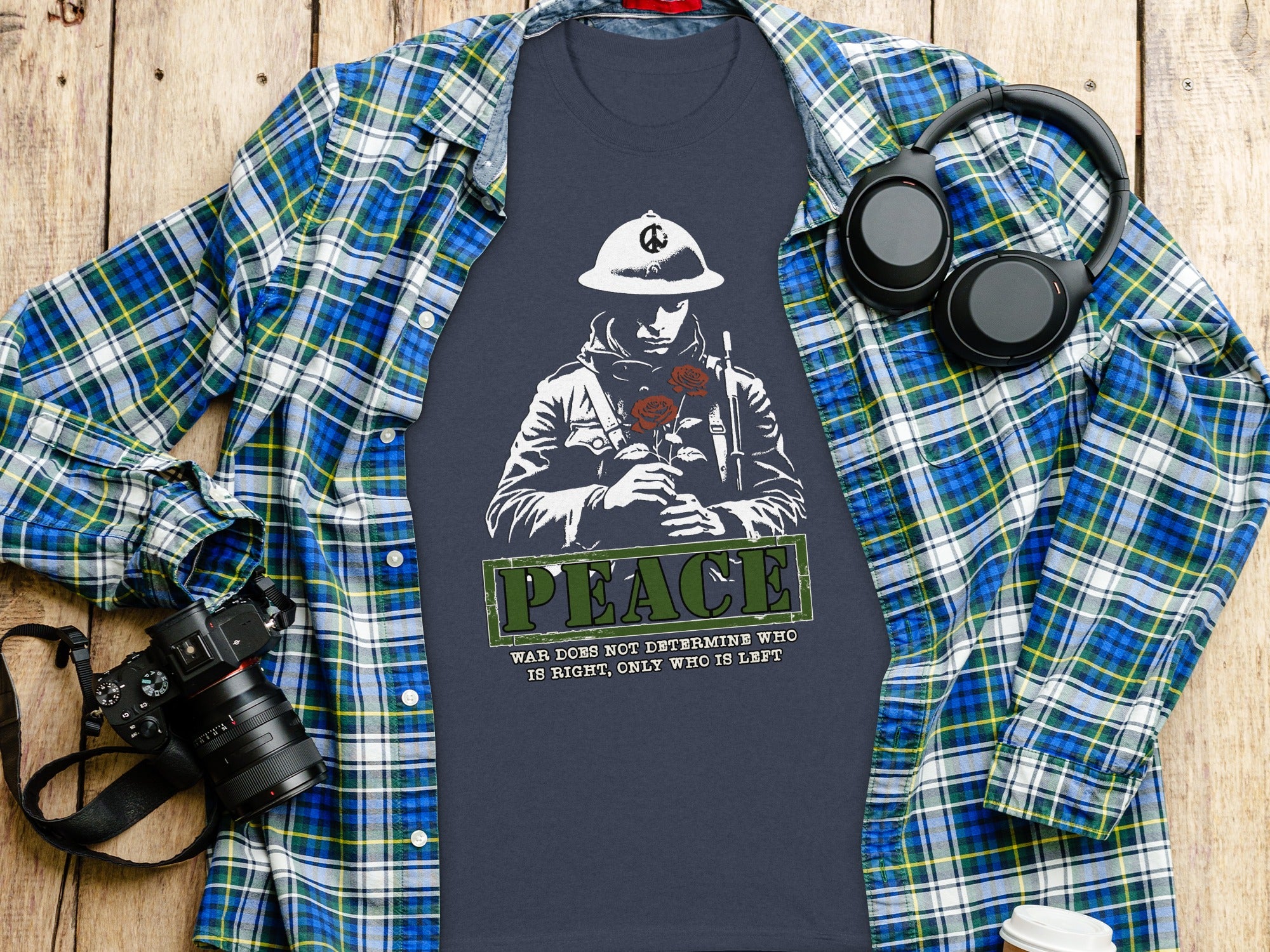 Dark t-shirt with illustration of a soldier holding roses and the word PEACE.