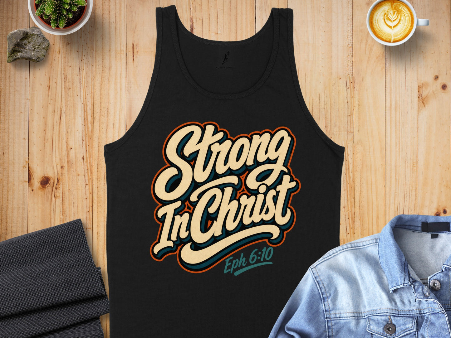 Black tank top with "Strong In Christ Eph 6:10" text.