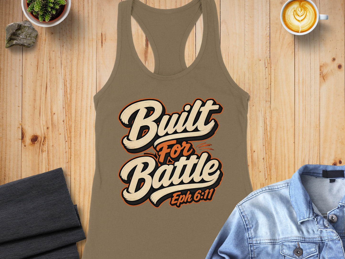 Brown tank top with "Built For Battle Eph 6:11" graphic design.
