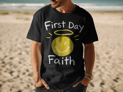 Black t-shirt with "First Day Faith" text and a yellow smiley face with halo.