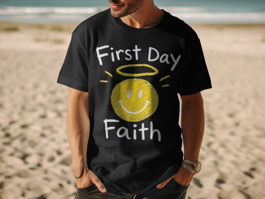 Black t-shirt with "First Day Faith" text and a yellow smiley face with halo.
