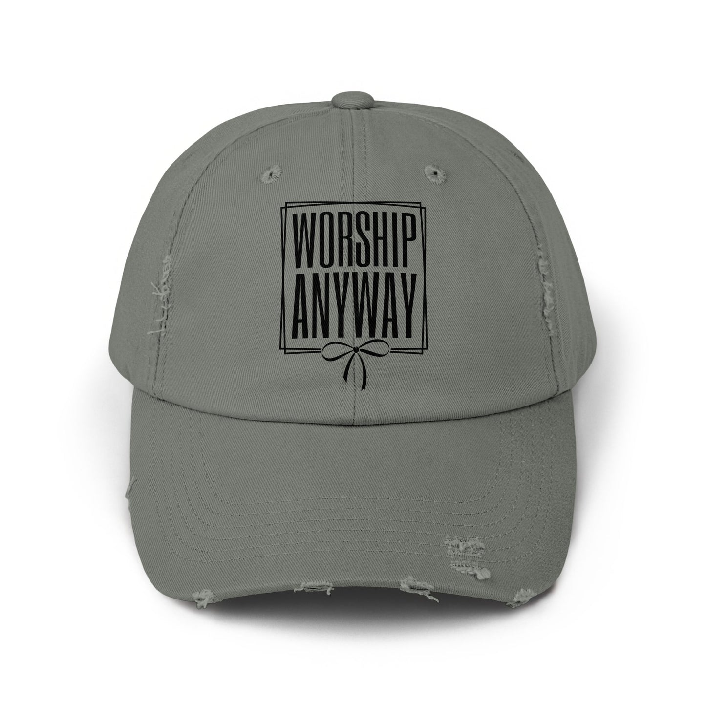 Tarnished grey distressed baseball cap with "WORSHIP ANYWAY" text above a bow.