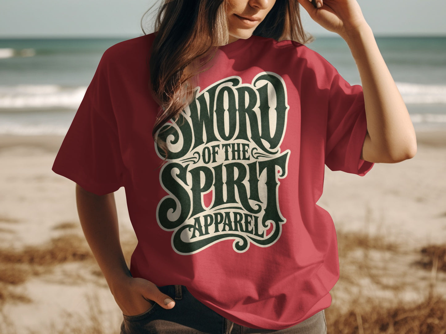 Salmon red t-shirt with "SWORD OF THE SPIRIT APPAREL" graphic.