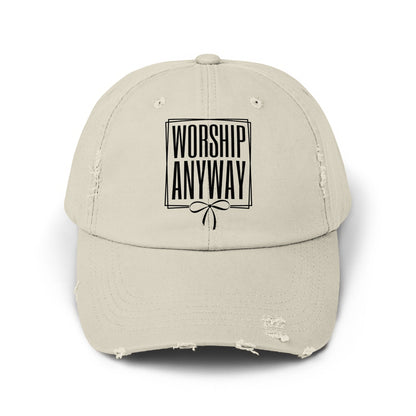 Distressed beige baseball cap with black text "WORSHIP ANYWAY" and a bow design.