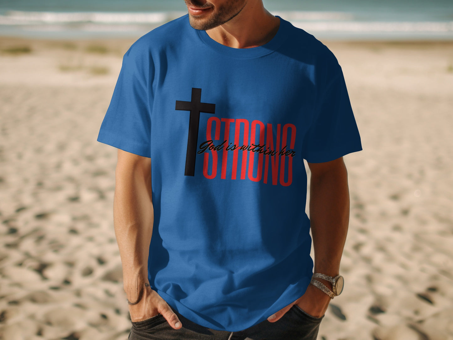 Blue t-shirt with black cross and red "STRONG God is within her" text.