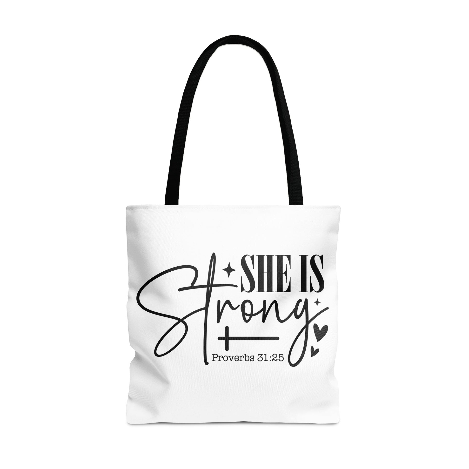 White tote bag with black handles featuring text "SHE IS Strong" and "Proverbs 31:25".