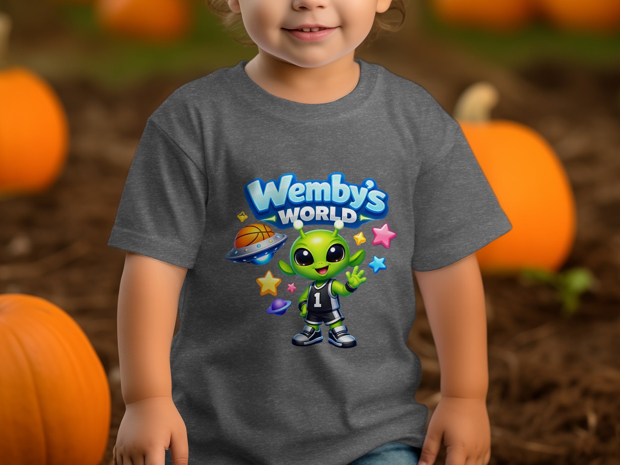 Grey t-shirt with Wemby's World logo featuring a basketball-playing alien amongst planets and stars.
