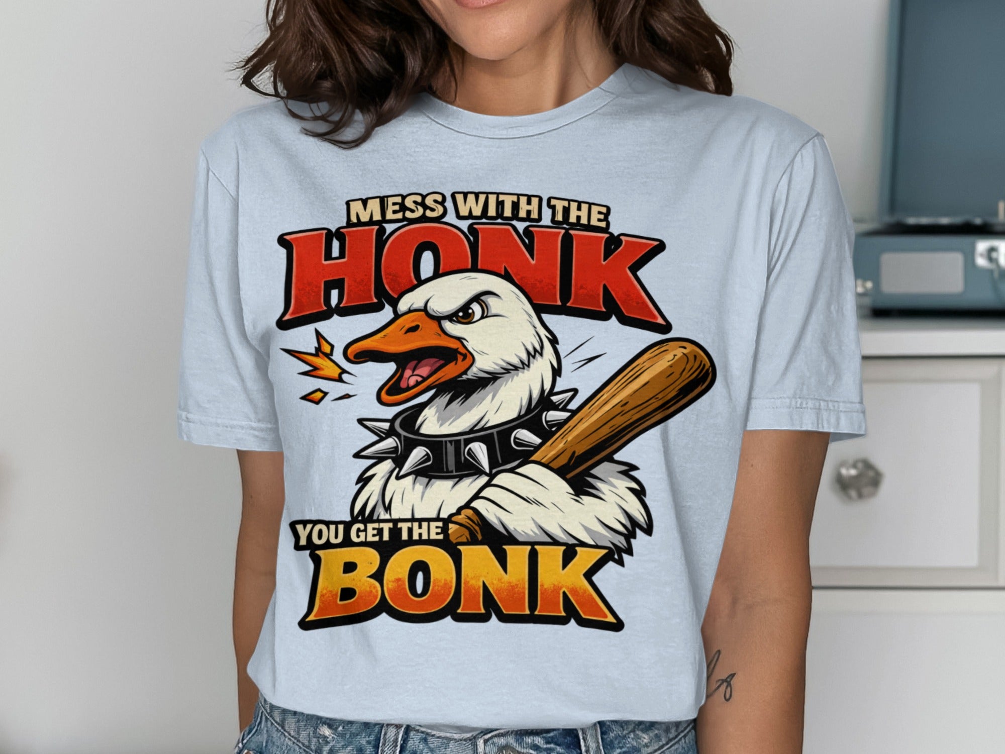 White goose with baseball bat and spiked collar, text "Mess with the honk you get the bonk"