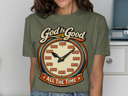 Olive green shirt with a clock graphic saying "God Is Good All The Time".
