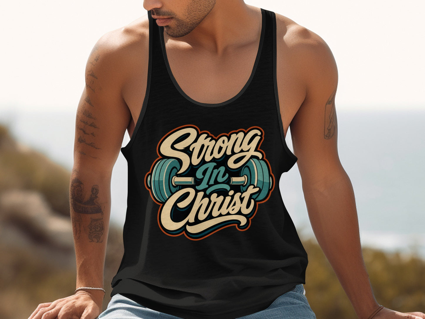 Black tank top with "Strong in Christ" graphic and barbell design.