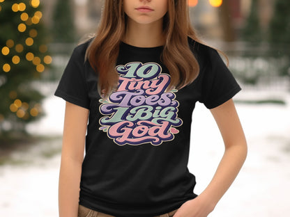 Black t-shirt with colorful text reading "10 Tiny Toes, 1 Big God."
