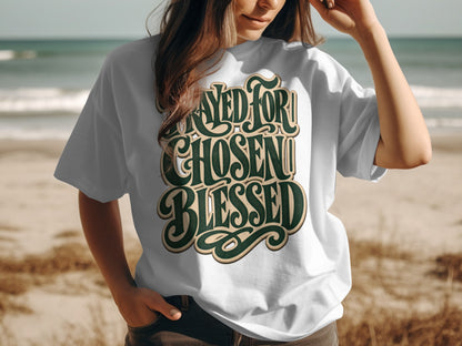 White t-shirt with green text: "PRAYED FOR CHOSEN BLESSED".