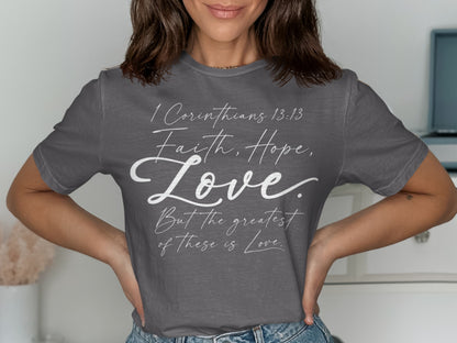 Grey t-shirt with white text: "1 Corinthians 13:13 Faith, Hope, Love. But the greatest of these is Love."