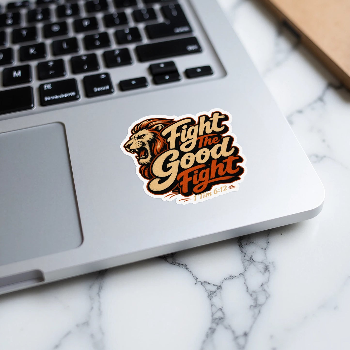 Lion sticker with text "Fight the Good Fight" and "1 Tim 6:12".
