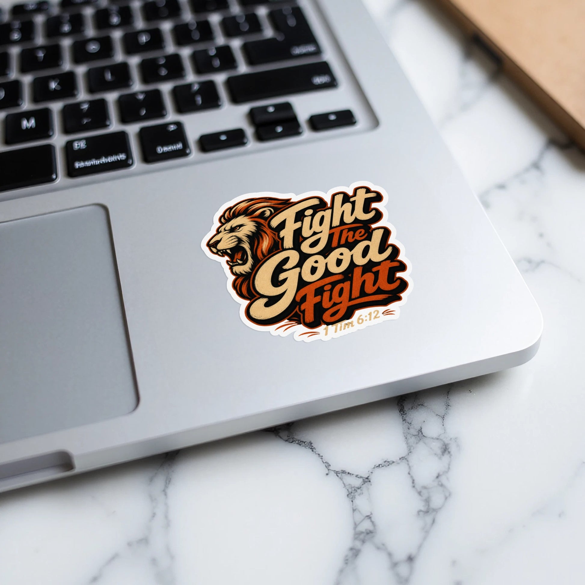 Lion sticker with text "Fight the Good Fight" and "1 Tim 6:12".