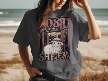 Sheep Club graphic tee on a person, featuring a sheep with a crown of thorns.