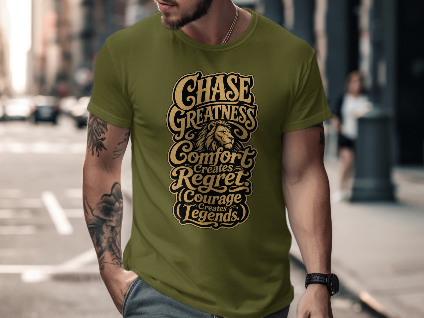 Olive t-shirt with gold text: "Chase Greatness Comfort Creates Regret Courage Creates Legends".