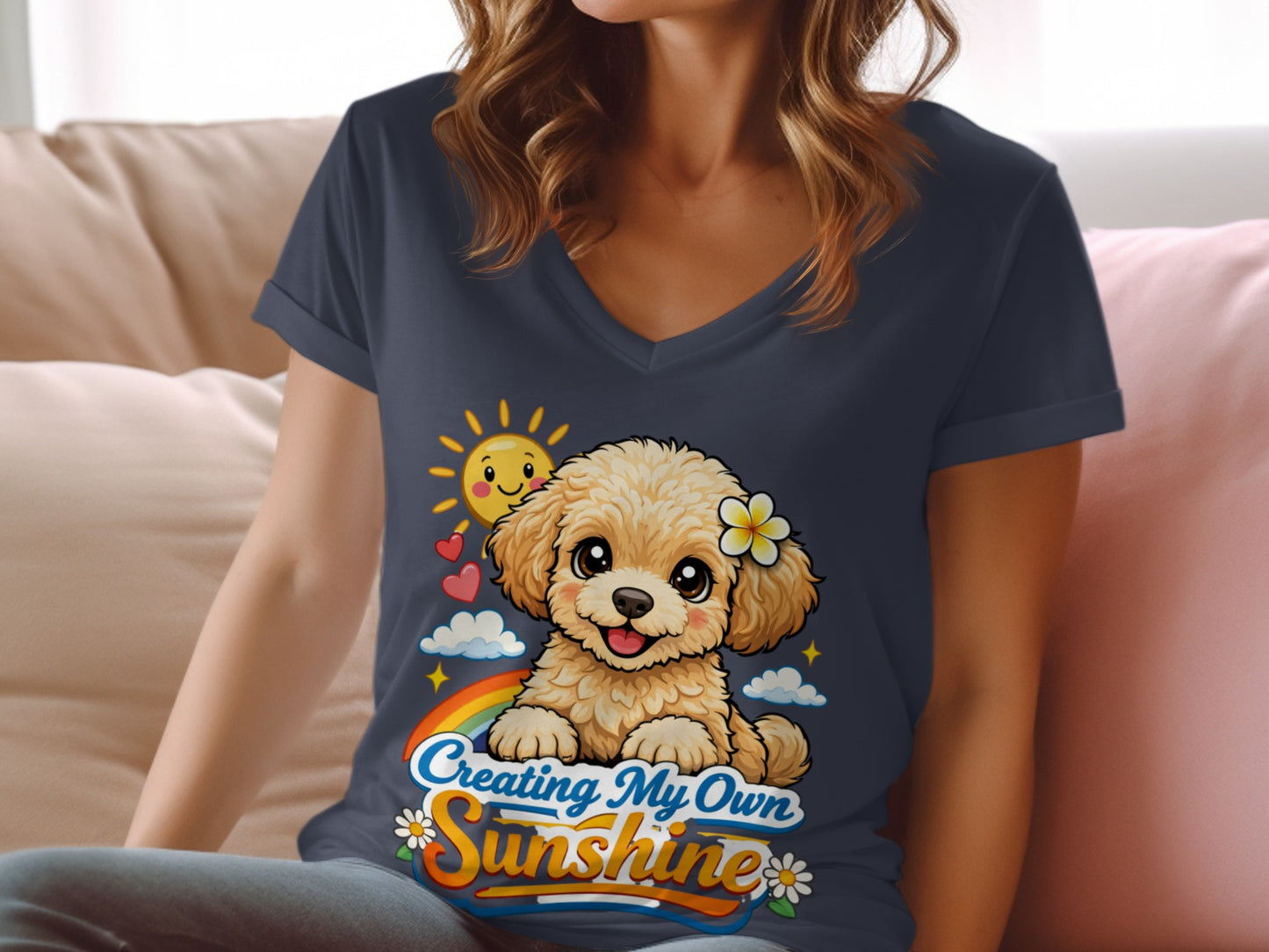 T-shirt graphic: fluffy dog with flower, sun, rainbow, and text "Creating My Own Sunshine"