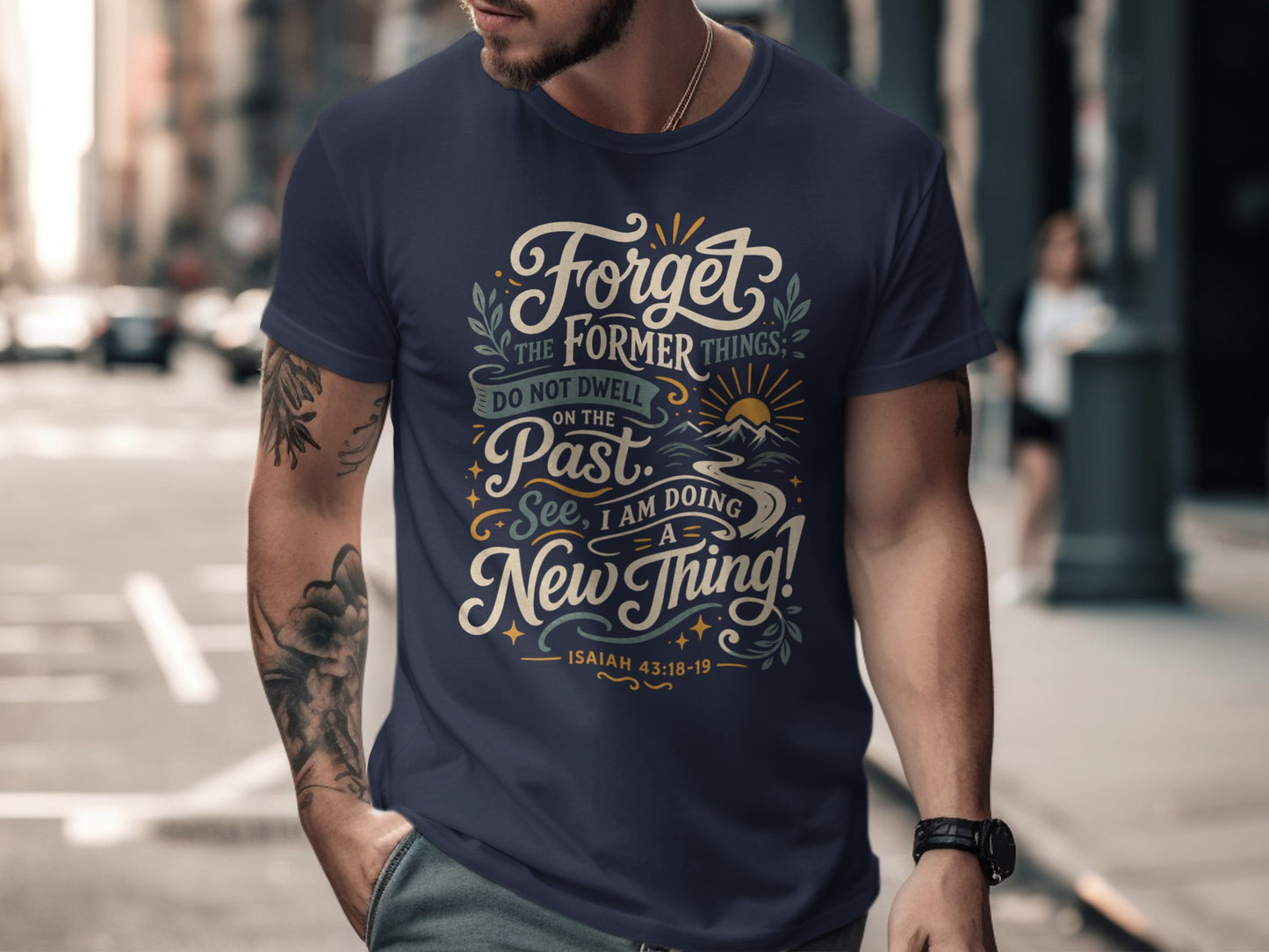 Navy t-shirt with "Forget the former things; do not dwell on the past. See, I am doing a new thing! Isaiah 43:18-19" text.