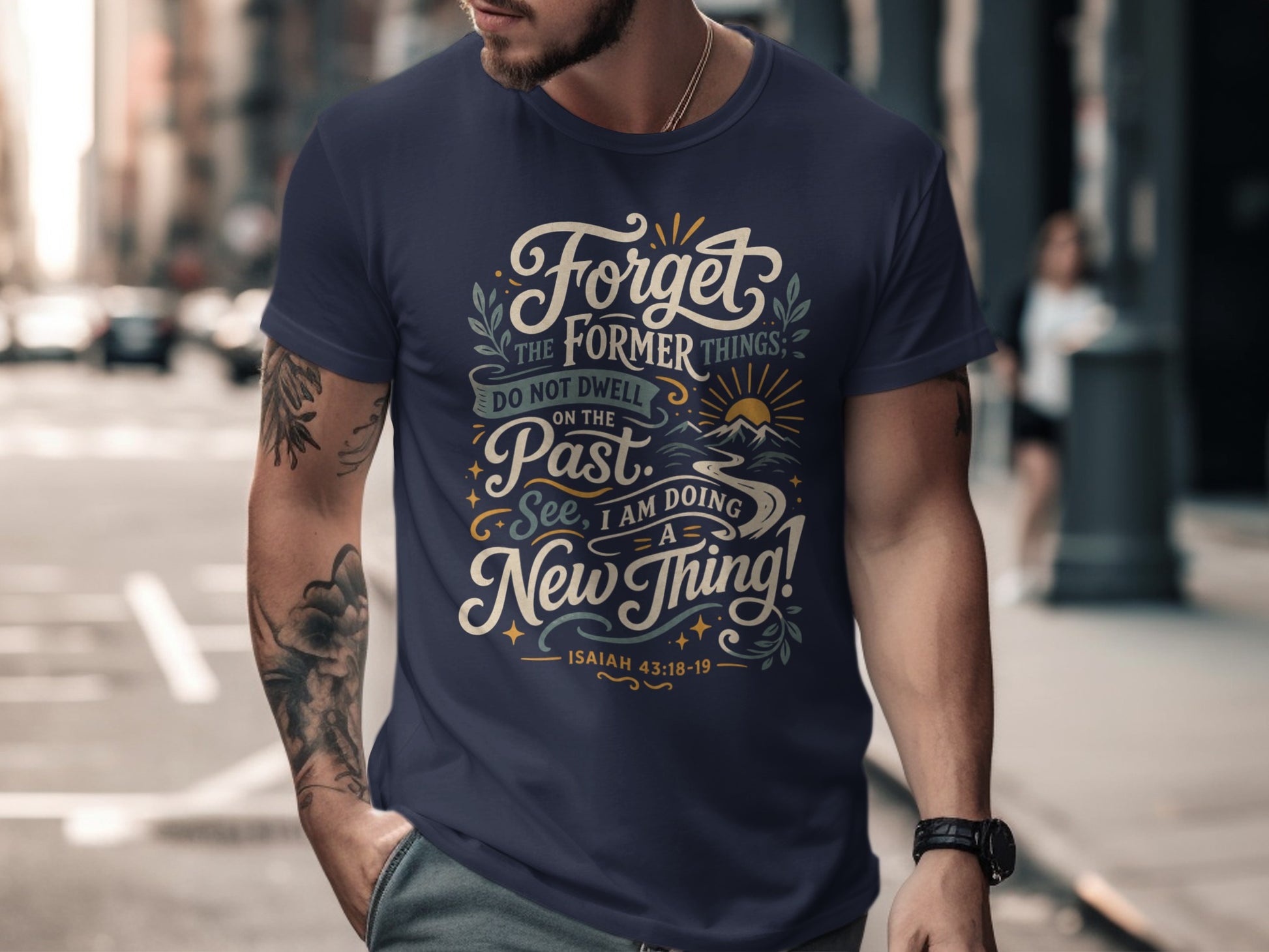 Navy t-shirt with "Forget the former things; do not dwell on the past. See, I am doing a new thing! Isaiah 43:18-19" text.