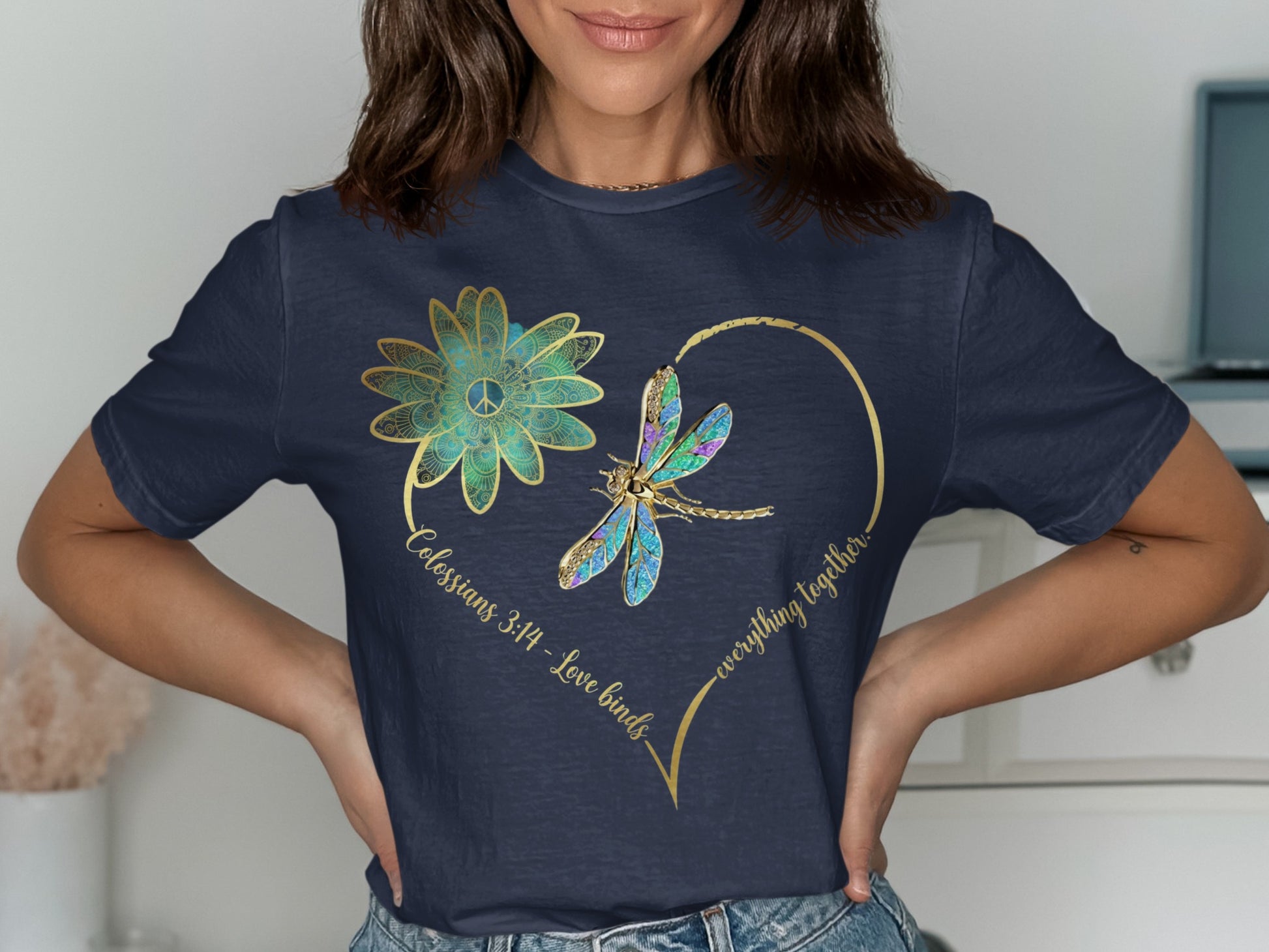 Navy t-shirt with a gold heart enclosing a dragonfly and a peace sign mandala flower.