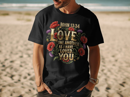 Black t-shirt with floral design and John 13:34 text: Love one another as I have loved you.