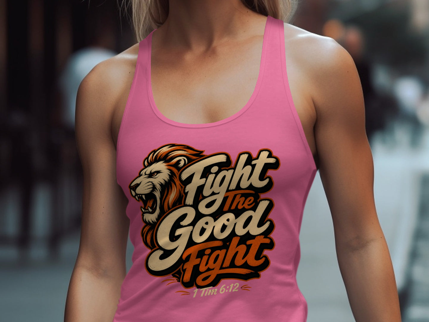 Pink tank top with a lion graphic and text "Fight the Good Fight" 1 Tim 6:12.