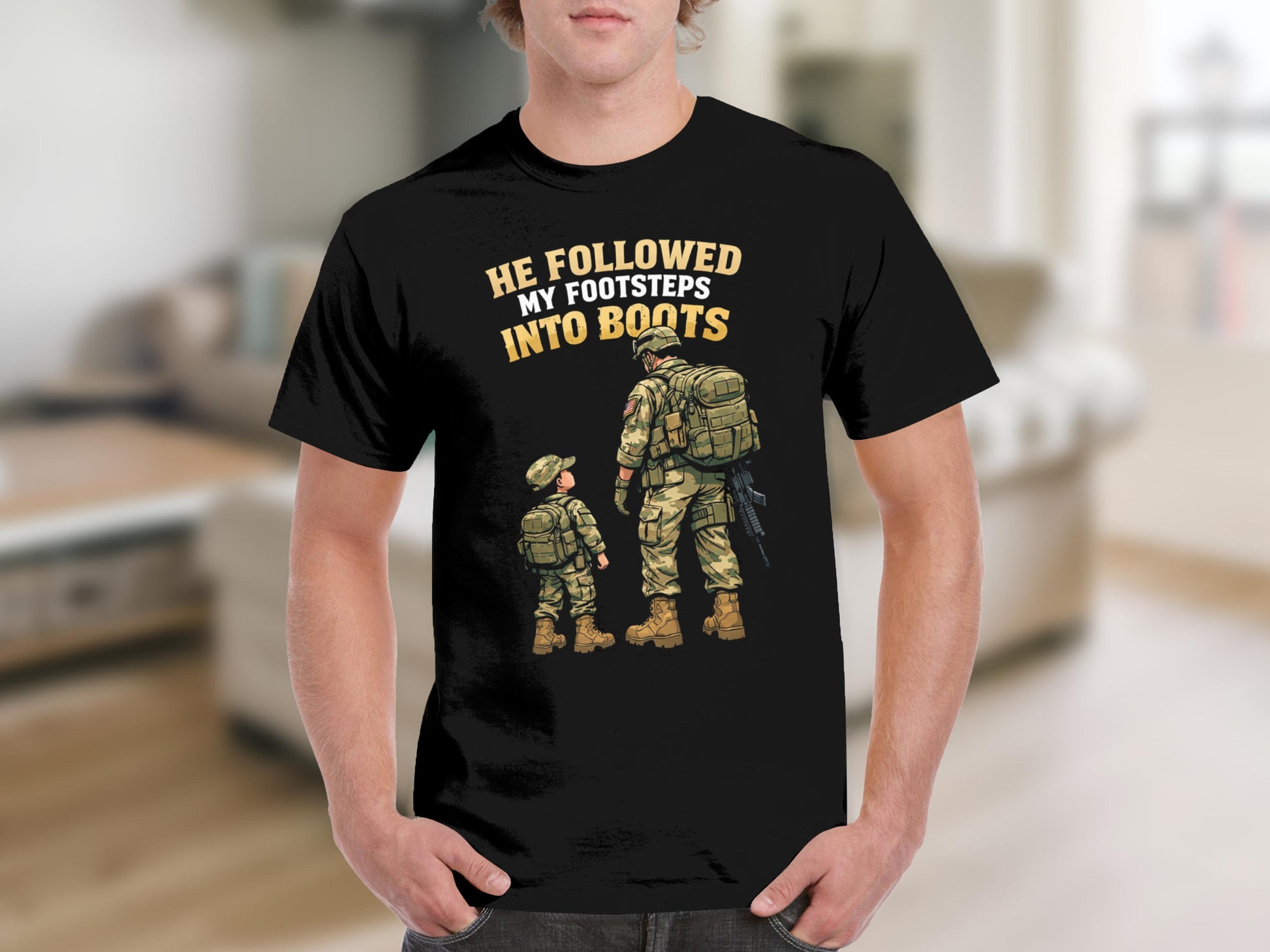 Black t-shirt graphic: soldier and child in uniform, text "HE FOLLOWED MY FOOTSTEPS INTO BOOTS".