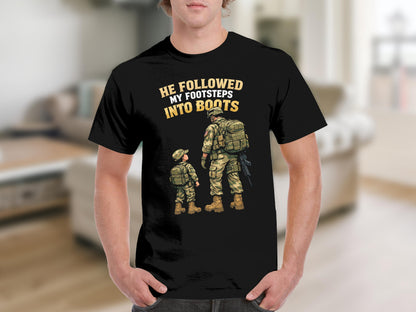 Black t-shirt graphic: soldier and child in uniform, text "HE FOLLOWED MY FOOTSTEPS INTO BOOTS".