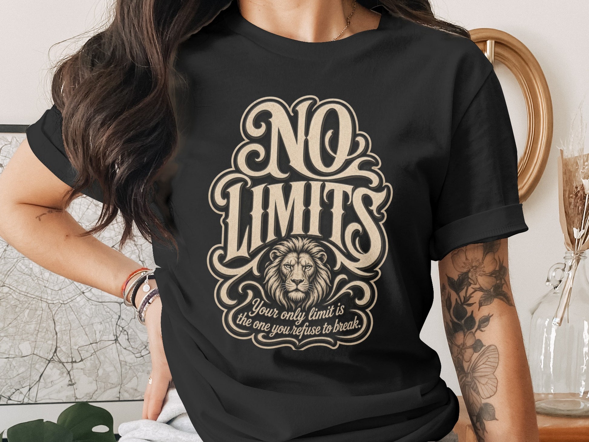 Black t-shirt with "NO LIMITS" text, lion, and inspiring quote.