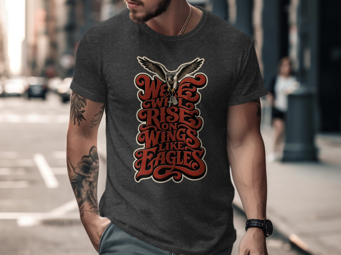 Dark grey t-shirt with "We Will Rise On Wings Like Eagles" text and a hawk.