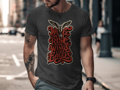 Dark grey t-shirt with "We Will Rise On Wings Like Eagles" text and a hawk.