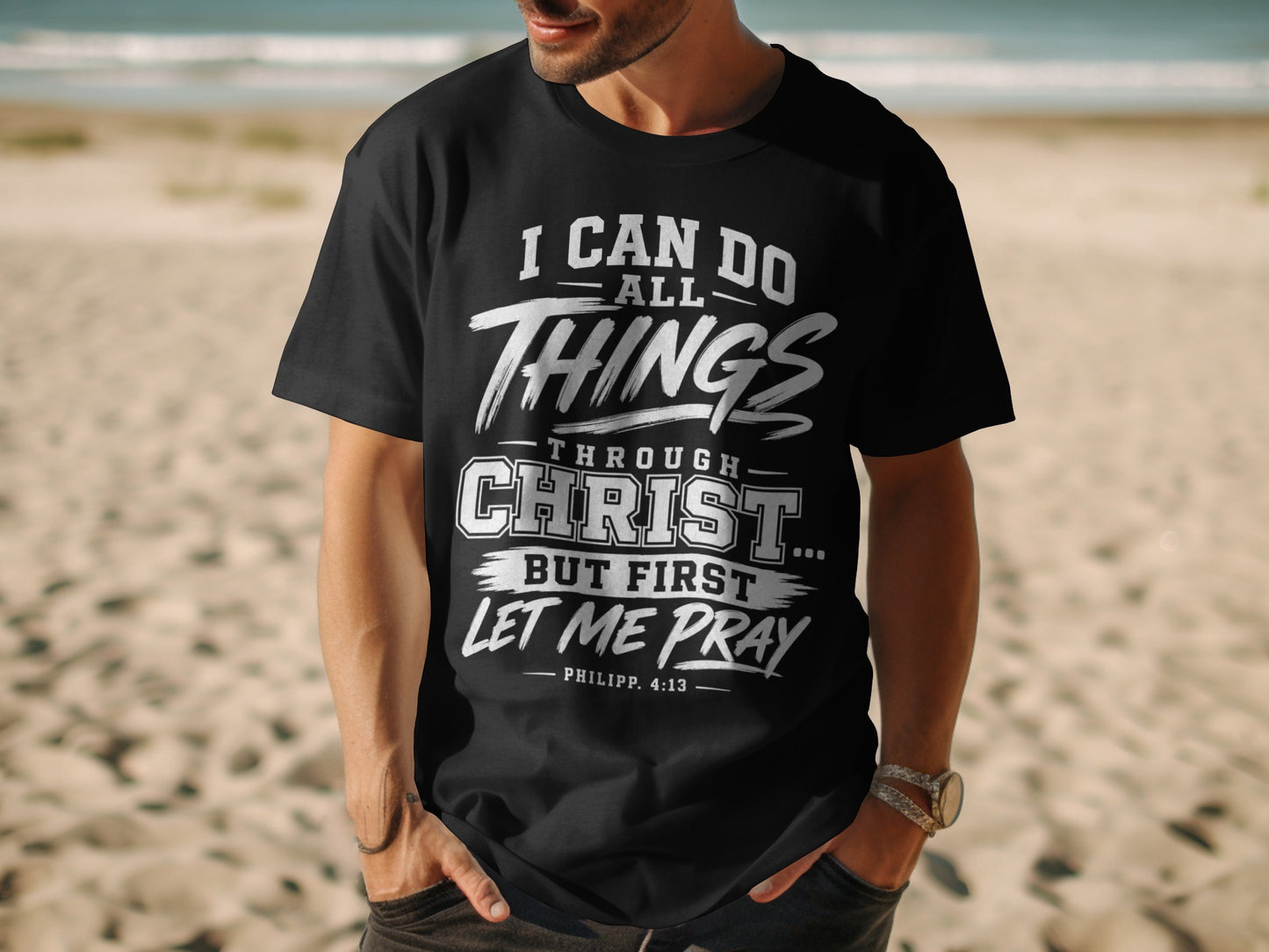 Black t-shirt with white text: "I CAN DO ALL THINGS THROUGH CHRIST... BUT FIRST LET ME PRAY PHILIPP. 4:13"