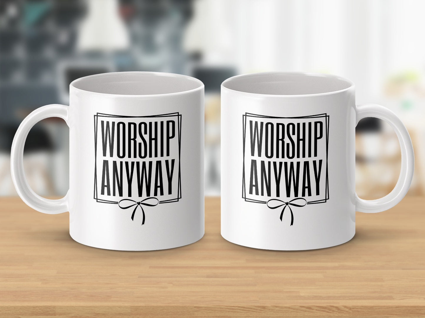 Two white mugs with "WORSHIP ANYWAY" text and a bow graphic.