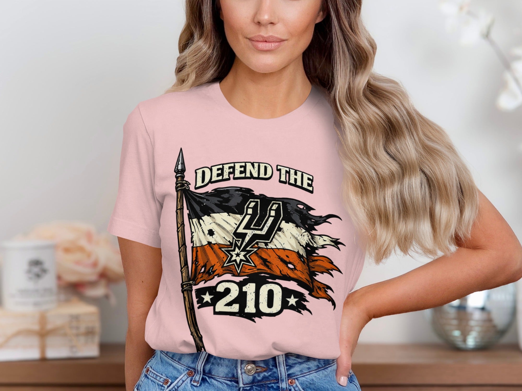 Pink t-shirt with distressed flag graphic and "DEFEND THE 210" text.