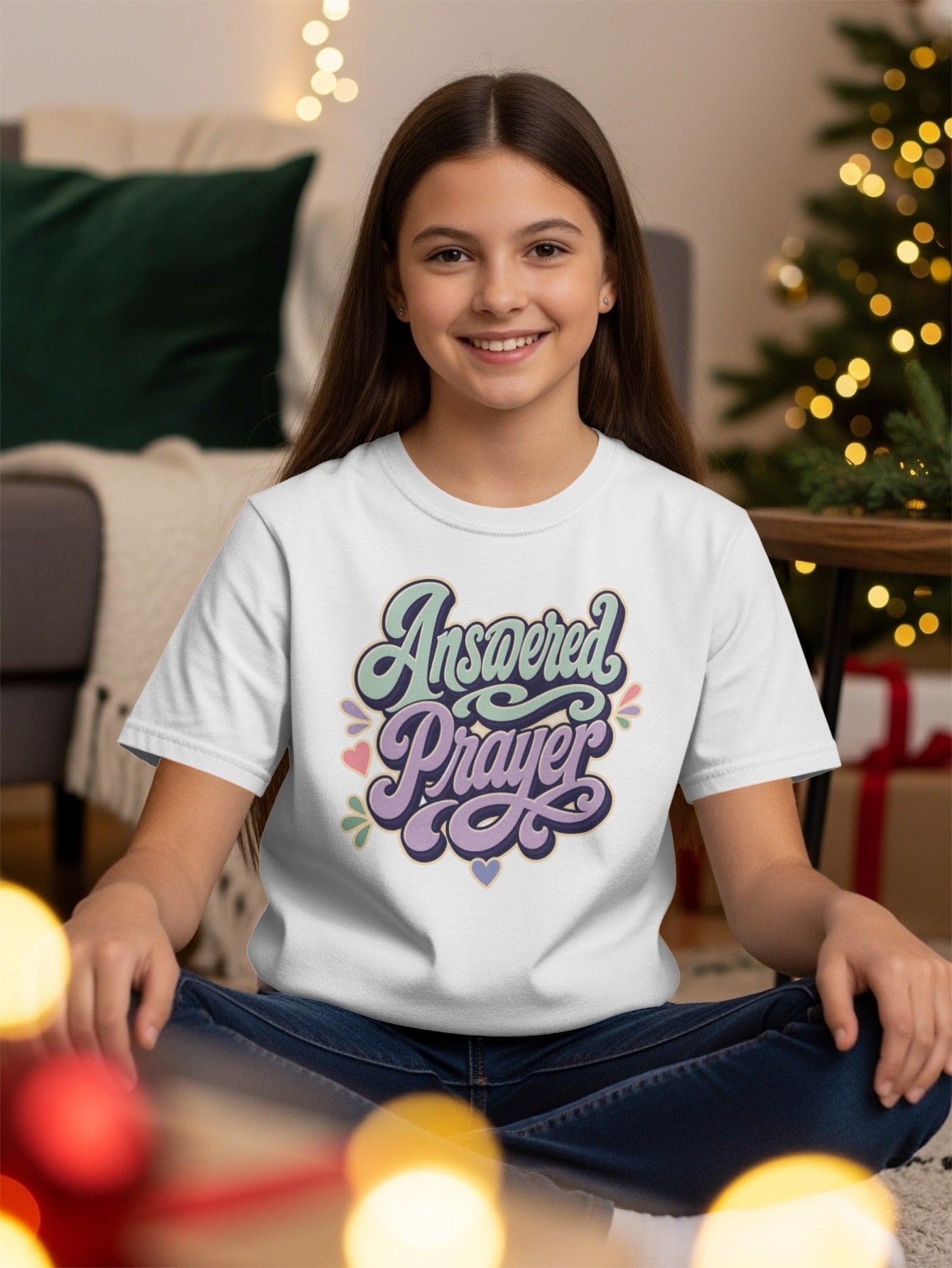 White t-shirt with "Answered Prayer" in stylized lettering and decorative hearts.