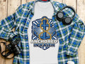 White t-shirt with "Anchored In Faith" text and blue anchor graphic.