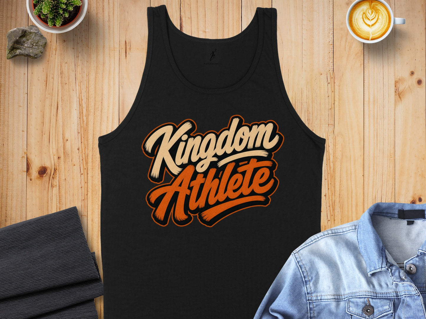 Black tank top with "Kingdom Athlete" text in cream and orange.