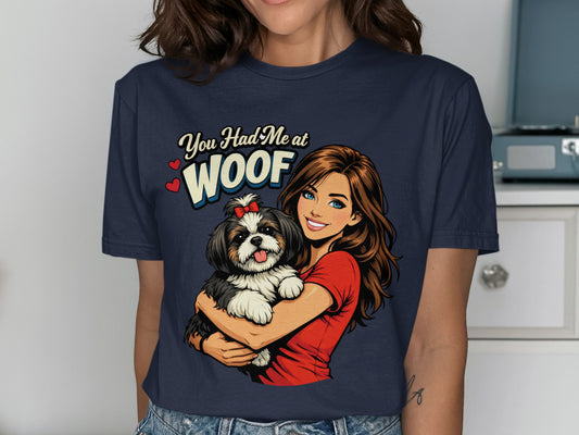 Woman holding small dog with text "You Had Me at WOOF"