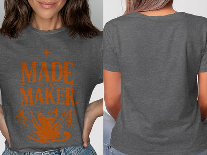 Charcoal t-shirt with text "MADE BY THE MAKER" and graphic design.