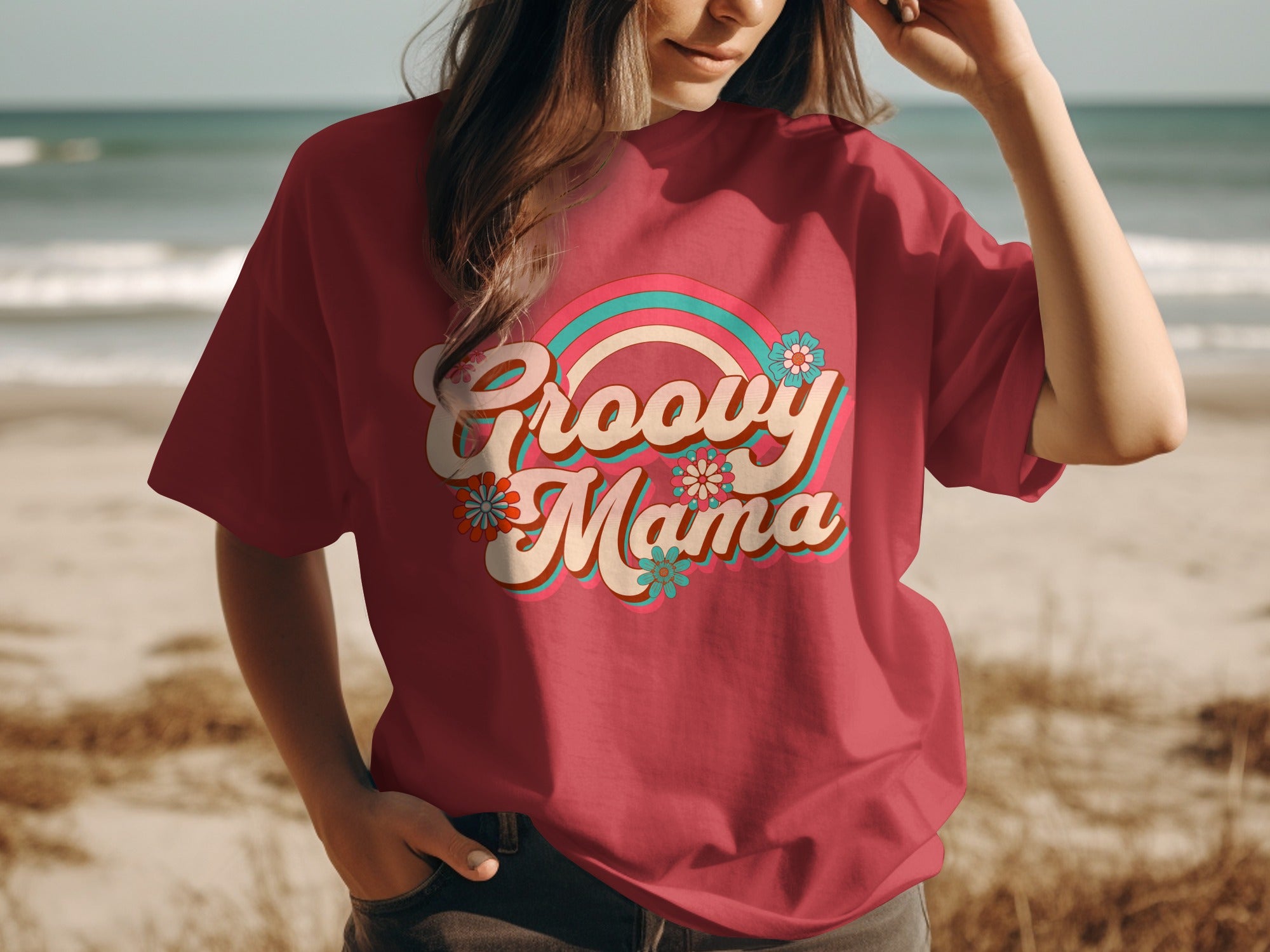 Red t-shirt with "Groovy Mama" text and retro rainbow design.