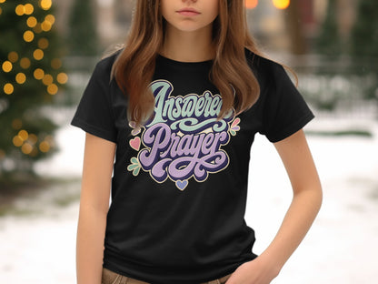 Black t-shirt with "Answered Prayer" text and decorative hearts.