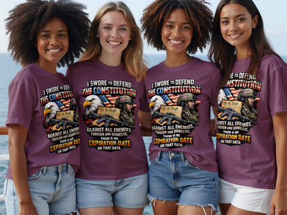 Four women wearing t-shirts with the text "I SWORE TO DEFEND THE CONSTITUTION".