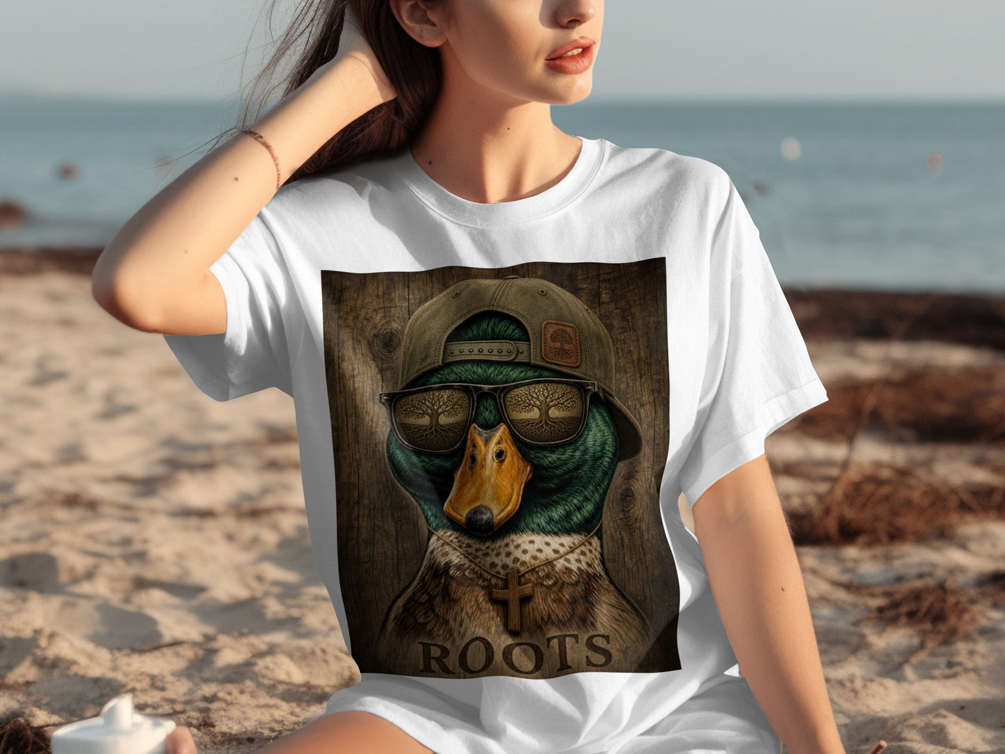 T-shirt with a duck wearing sunglasses and a cross necklace, text reads "ROOTS".