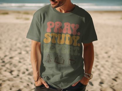 Olive green t-shirt with "Pray. Study. Repeat." text and icons of hands, book, and coffee.