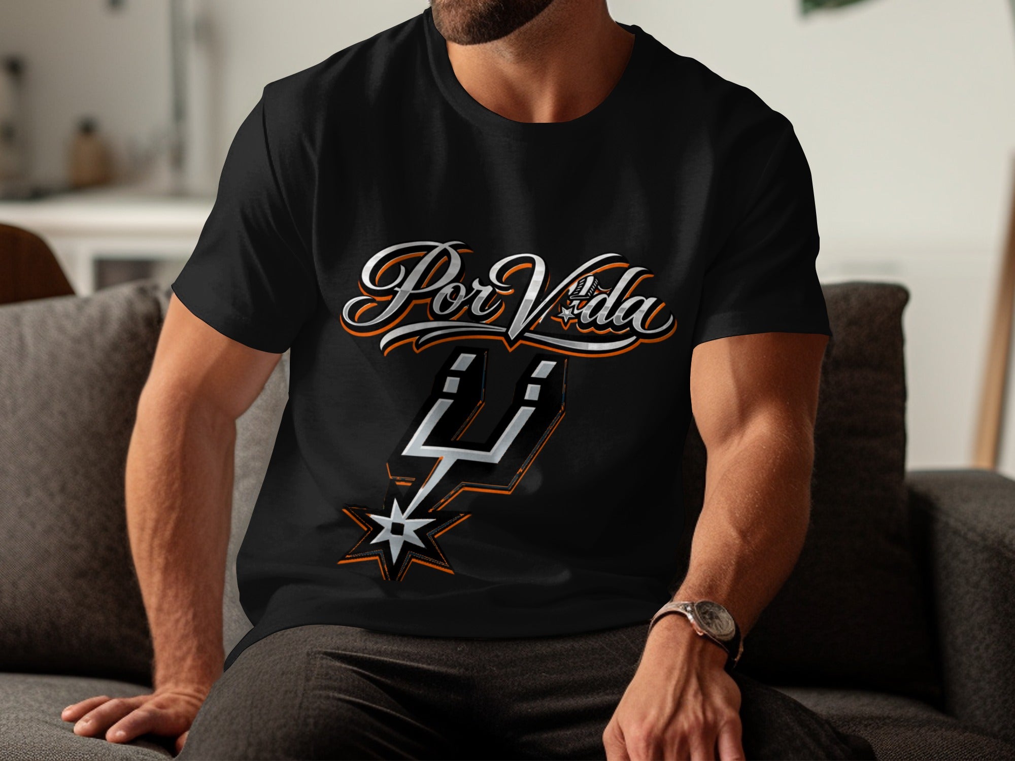 Black t-shirt with "Por Vida" text and a silver and orange spur logo.