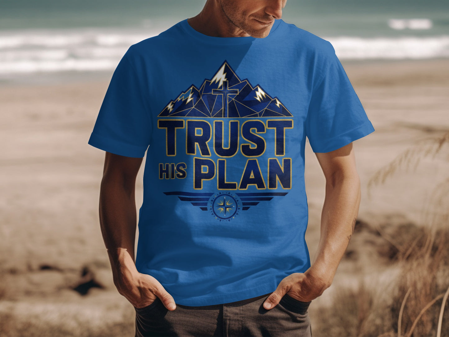 Blue t-shirt with mountains, cross, and "Trust His Plan" text.