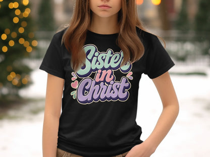 Black t-shirt with "Sister in Christ" text in pastel retro font.