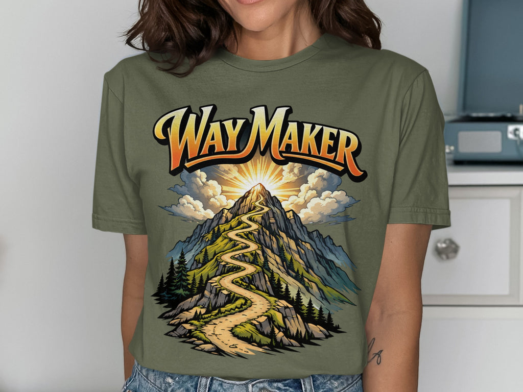 Olive green t-shirt with "Way Maker" text over a winding mountain path.